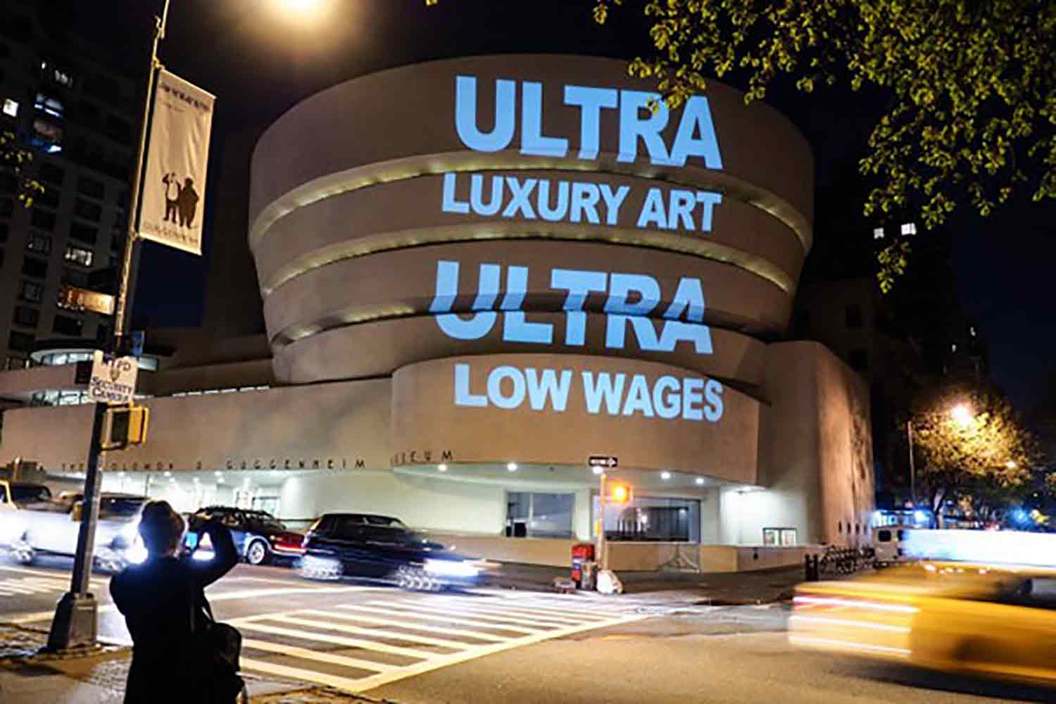 A Gulf Labor action projects slogans onto the Guggenheim Museum, New York.